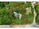 Aerial view of property with a defined border, showing a home and pool surrounded by trees at 1460 Bakers Bridge Rd, Douglasville, GA 30134