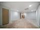 Basement space with unfinished flooring, multiple doors, and recessed lighting at 1460 Bakers Bridge Rd, Douglasville, GA 30134