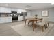 Basement kitchenette with white cabinets and stainless steel appliances at 1460 Bakers Bridge Rd, Douglasville, GA 30134