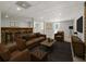 Virtual staging of finished basement features leather seating, a wet bar, and decor at 1460 Bakers Bridge Rd, Douglasville, GA 30134