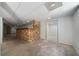 View of the basement featuring a unique stone-covered bar with wood countertop at 1460 Bakers Bridge Rd, Douglasville, GA 30134