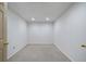 An empty basement room featuring an unfinished floor and white walls at 1460 Bakers Bridge Rd, Douglasville, GA 30134