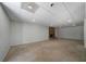 Basement featuring a stone fireplace and an unfinished floor at 1460 Bakers Bridge Rd, Douglasville, GA 30134