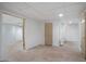 Basement room with unfinished floors, white walls, and multiple entryways at 1460 Bakers Bridge Rd, Douglasville, GA 30134