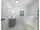 Bathroom featuring a soaking tub, tiled floors, modern vanity and a window at 1460 Bakers Bridge Rd, Douglasville, GA 30134
