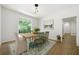 Bright dining room featuring hardwood floors, a large window and dining table at 1460 Bakers Bridge Rd, Douglasville, GA 30134