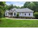 Charming single-story home featuring a well-manicured lawn and traditional architectural details at 1460 Bakers Bridge Rd, Douglasville, GA 30134