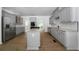 Spacious kitchen with stainless appliances, gray cabinets, an island and granite countertops at 1460 Bakers Bridge Rd, Douglasville, GA 30134