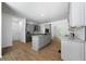 Open concept kitchen features stainless appliances, gray cabinets, and granite counters at 1460 Bakers Bridge Rd, Douglasville, GA 30134