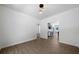Open layout living room featuring hardwood floors, white walls and open spaces at 1460 Bakers Bridge Rd, Douglasville, GA 30134