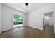 Bright living room featuring hardwood floors and a large window with natural light at 1460 Bakers Bridge Rd, Douglasville, GA 30134