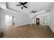 Spacious living room with hardwood floors and arched entryways is well lit with recessed lighting at 1460 Bakers Bridge Rd, Douglasville, GA 30134