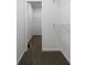 Walk-in closet featuring wall-mounted shelving and carpeted floors at 1460 Bakers Bridge Rd, Douglasville, GA 30134