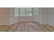 Breakfast nook with a large window, bringing in natural light, and updated flooring at 2690 Ross Rd, Snellville, GA 30039