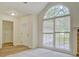 Entryway featuring wood flooring, an arched window, and an entry door at 2690 Ross Rd, Snellville, GA 30039