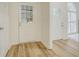 Inviting entryway features stylish wood-look flooring and natural light from surrounding windows at 2690 Ross Rd, Snellville, GA 30039