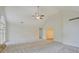 Bright, open living room features a vaulted ceiling, ceiling fan, and large windows at 2690 Ross Rd, Snellville, GA 30039