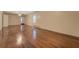 Large living room with hardwood floors, neutral walls, and natural light at 2690 Ross Rd, Snellville, GA 30039
