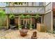 Backyard featuring covered patio with grill, outdoor seating, and landscaped yard at 3745 Meeting St, Duluth, GA 30096