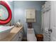 Bathroom featuring a sink with vanity, modern toilet, cabinet, and shower at 3745 Meeting St, Duluth, GA 30096