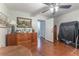 Bedroom with ceiling fan, dresser with artwork, and an open door to a closet at 3745 Meeting St, Duluth, GA 30096