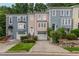 Colorful townhomes with attached garages, neat landscaping, and inviting entrances for an attractive curb appeal at 3745 Meeting St, Duluth, GA 30096