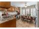 Cozy kitchen featuring wood cabinets, stainless steel appliances, and a breakfast nook with bright shutters at 3745 Meeting St, Duluth, GA 30096