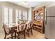 Breakfast nook featuring plantation shutters, a wooden table with chairs, and stylish hutch at 3745 Meeting St, Duluth, GA 30096