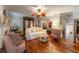 Comfortable living area with hardwood floors, ornate ceiling fan and neutral-toned furnishings at 3745 Meeting St, Duluth, GA 30096