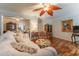 Inviting living space with hardwood floors, a stylish ceiling fan, and elegant, neutral decor at 3745 Meeting St, Duluth, GA 30096