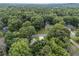 Aerial view of a neighborhood with homes nestled among dense trees, highlighting a peaceful community at 41 Wexford Nw Cir, Cartersville, GA 30121