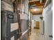 Basement utility area with mechanical equipment, exposed ducts, and storage solutions at 41 Wexford Nw Cir, Cartersville, GA 30121