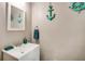 Nautical themed powder room with a white vanity and maritime decorations at 41 Wexford Nw Cir, Cartersville, GA 30121