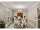 Formal dining room with hardwood floors, crown molding, and shuttered windows at 41 Wexford Nw Cir, Cartersville, GA 30121