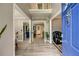 Inviting foyer with hardwood floors, a view of open living spaces, and a bright blue front door at 41 Wexford Nw Cir, Cartersville, GA 30121