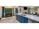Modern kitchen featuring blue cabinets, a wine cooler, stainless steel appliances and an island with seating at 41 Wexford Nw Cir, Cartersville, GA 30121