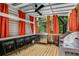 Outdoor kitchen and seating area featuring a grill, sink, and orange curtains for privacy at 41 Wexford Nw Cir, Cartersville, GA 30121