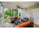 Inviting covered patio with stylish outdoor seating, a ceiling fan, and serene wooded views at 41 Wexford Nw Cir, Cartersville, GA 30121