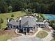 Aerial view of community clubhouse and amenities featuring a pool and tennis courts at 109 Laurelwood Ln, Dallas, GA 30157