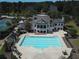 Aerial view of clubhouse featuring a large pool and surrounding greenery at 109 Laurelwood Ln, Dallas, GA 30157