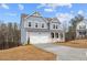 Charming two-story home with a two-car garage, covered front porch, and blue siding at 109 Laurelwood Ln, Dallas, GA 30157