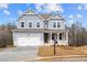 Beautiful two-story home with a covered porch, white trim, and a well-manicured lawn at 109 Laurelwood Ln, Dallas, GA 30157