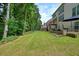 Expansive backyard featuring a well-manicured lawn and wooded views for privacy at 1680 Laleiah Dr, Cumming, GA 30041