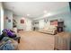Spacious finished basement area with neutral carpet, cozy seating, and ample room for recreation and relaxation at 1680 Laleiah Dr, Cumming, GA 30041