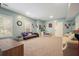 Large carpeted basement with couches, throw pillows, and neutral paint at 1680 Laleiah Dr, Cumming, GA 30041
