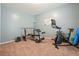 Home exercise room with carpet, and a variety of workout equipment at 1680 Laleiah Dr, Cumming, GA 30041