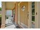 Inviting front door with sidelights and a welcoming wreath, complemented by a cozy porch at 1680 Laleiah Dr, Cumming, GA 30041