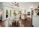 Eat-in kitchen with central island, stainless appliances, and access to back patio at 1680 Laleiah Dr, Cumming, GA 30041