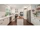 Bright kitchen with stainless appliances, center island and white subway tile at 1680 Laleiah Dr, Cumming, GA 30041
