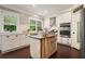 Modern kitchen with island, stainless appliances, and white cabinetry at 1680 Laleiah Dr, Cumming, GA 30041